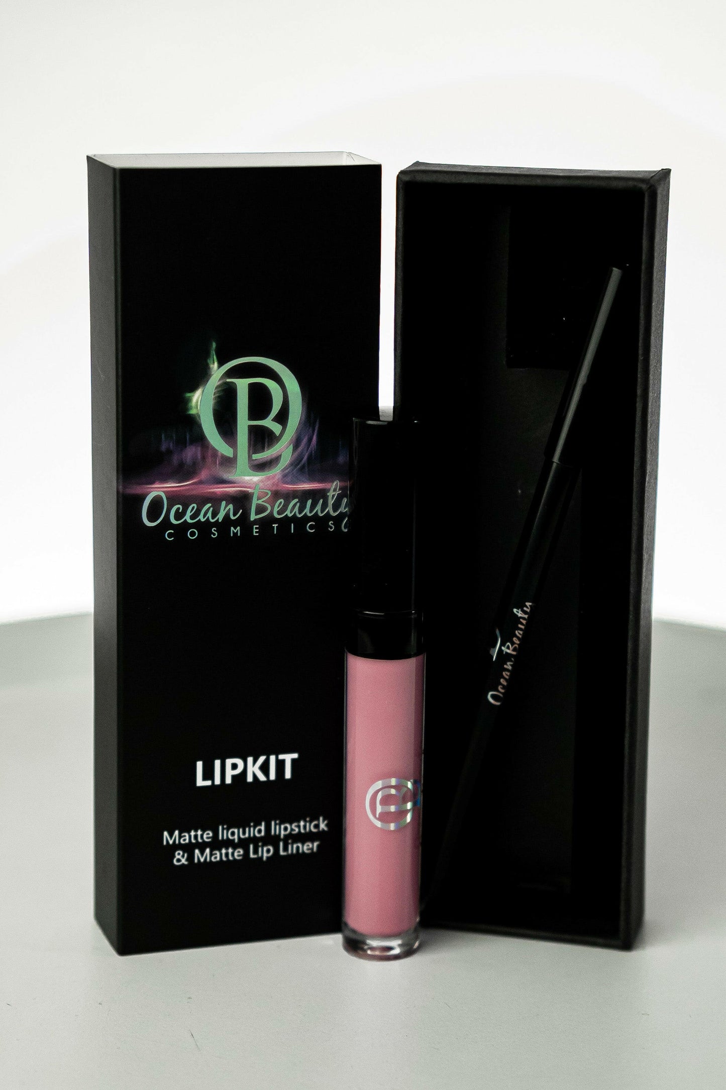 Discover Ocean Beauty Cosmetics Tangy Lipkit, a stunning duo that enhances your natural beauty. This lip kit includes a vibrant lipstick and a matching lip liner, offering a perfect combination for creating flawless and long-lasting lip looks. With high-quality pigments, this lip duo provides a rich and luscious color payoff that's ideal for any occasion. Alt Text: Image: Ocean Beauty Cosmetics Yeah Lipkit with Matching Lip Liner - A vibrant lipstick and lip liner duo for stunning lip looks.